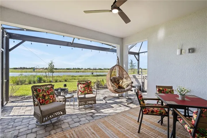 Expansive screened lanai offering plenty of space for outdoor dining, watching sports or movies on your outside TV while enjoying peaceful [anoramic water views