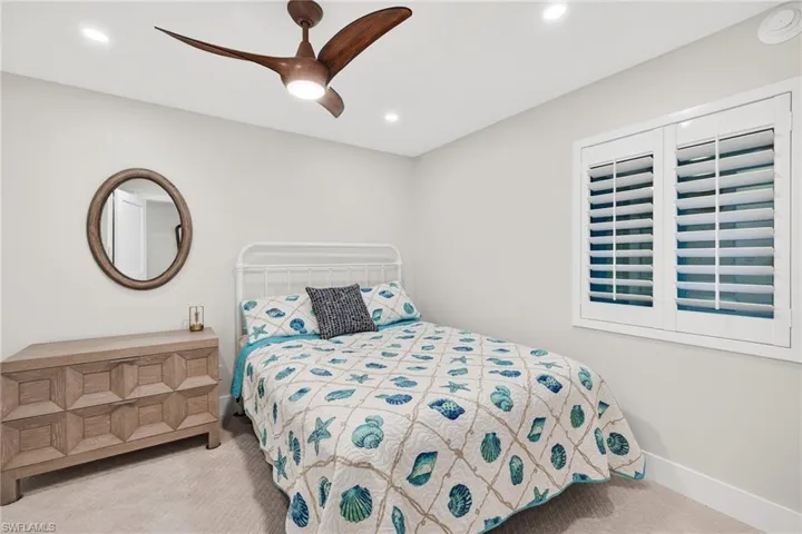 Bedroom with carpet floors, a ceiling fan, and recessed lighting