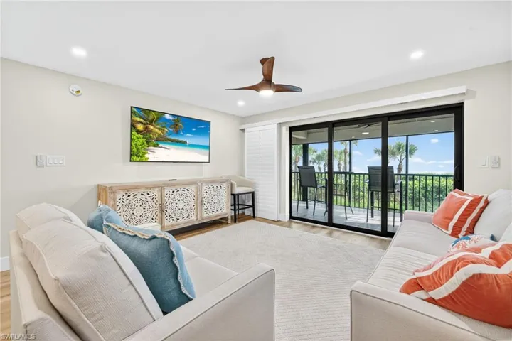 Living area featuring wood finished floors, recessed lighting, and ceiling fan