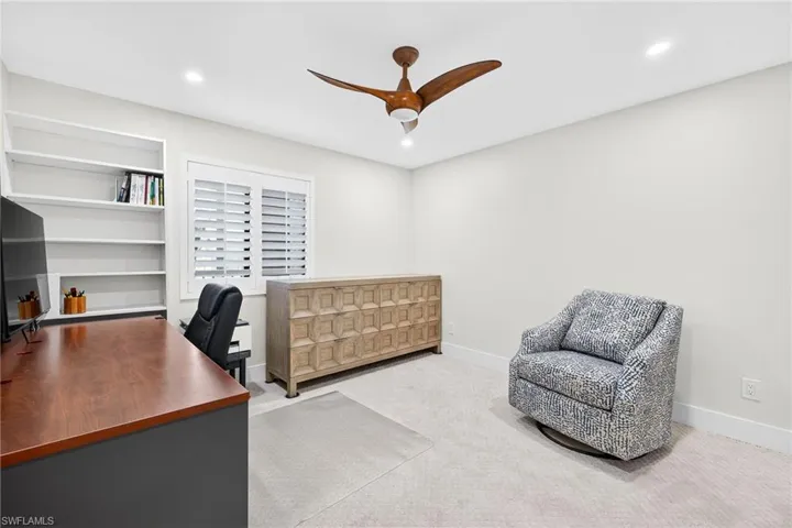Home office featuring carpet floors, a ceiling fan, and recessed lighting