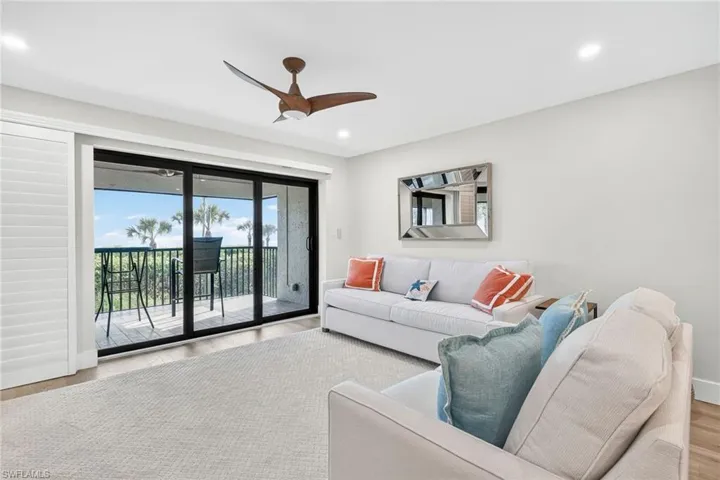 Living area featuring wood finished floors, recessed lighting, and ceiling fan
