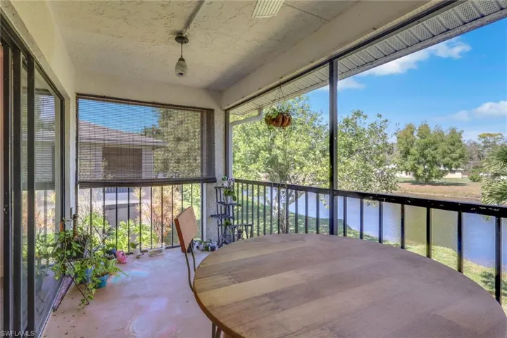 Sunroom / solarium with a balcony