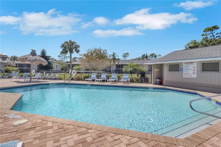 Community pool with a patio