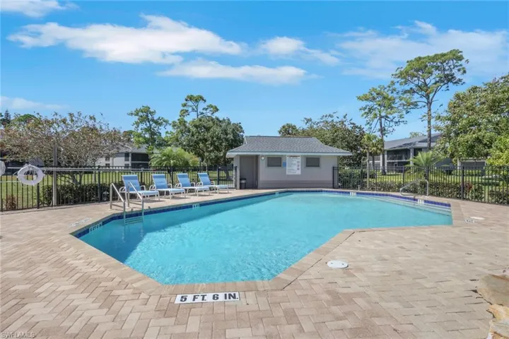 Community pool featuring a patio