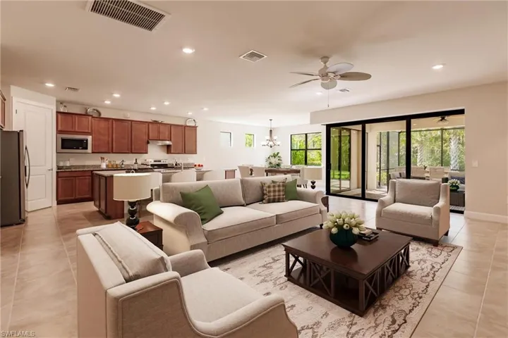 Virtually staged great room/kitchen/dining area