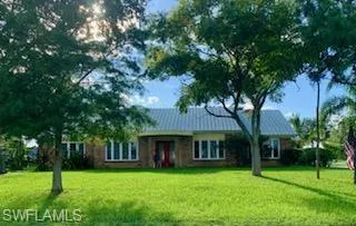 Single story home featuring a front yard