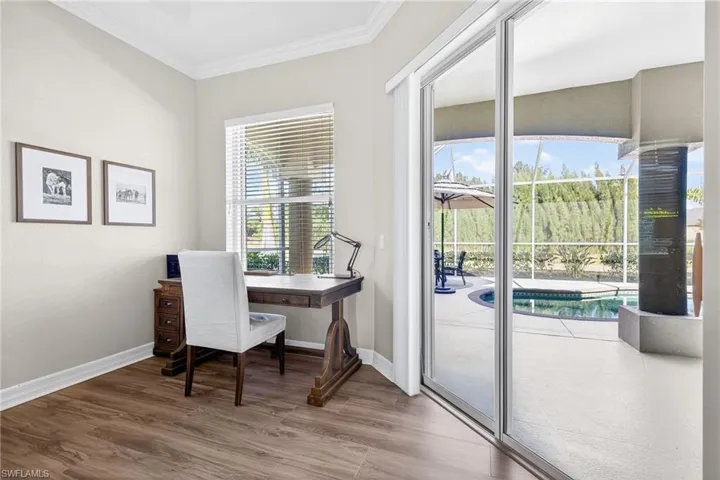 Office with wood finished floors and ornamental molding