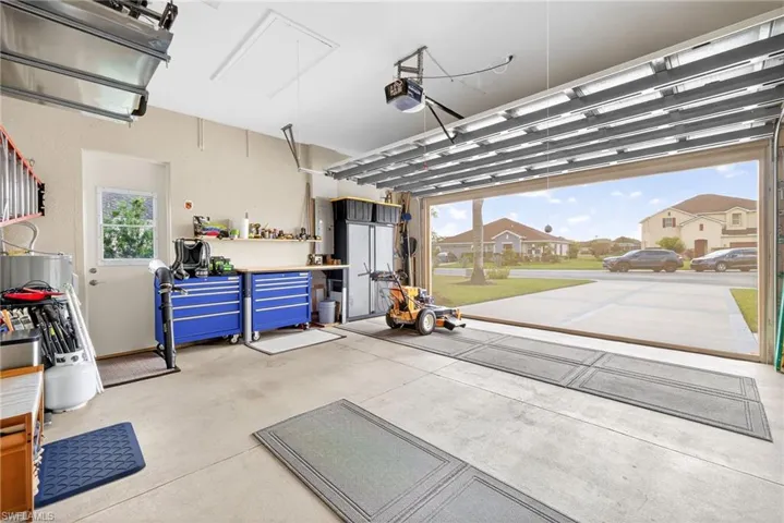 Garage with a residential view and a garage door opener