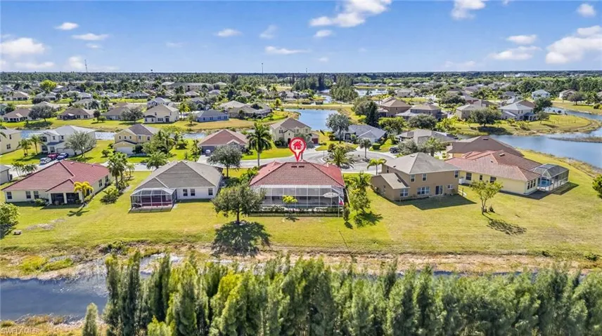 Aerial view of residential area with a large body of water