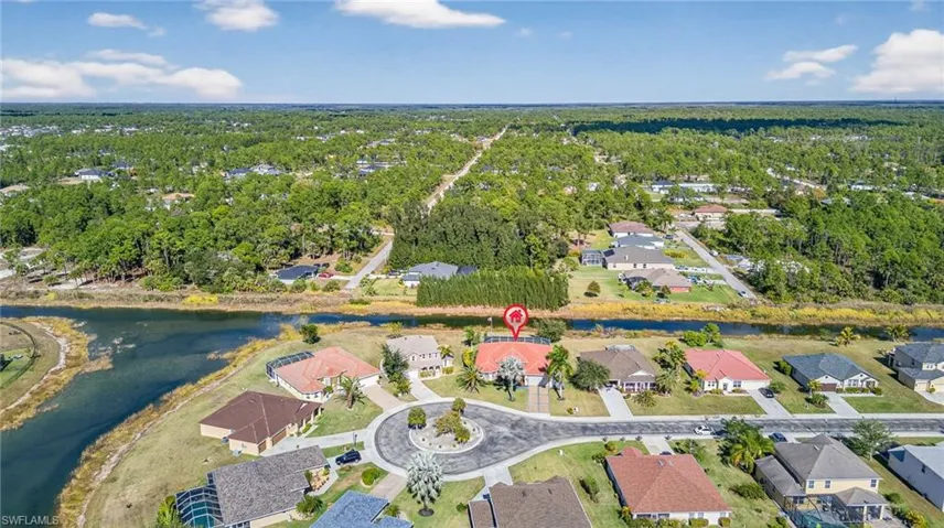 View of property location featuring a nearby body of water and nearby suburban area