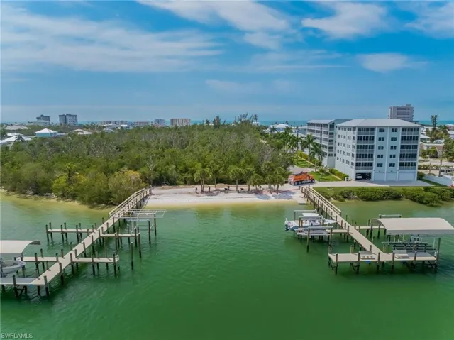 Two boat docks, private beach, and two buildings at Sea Grape Condo