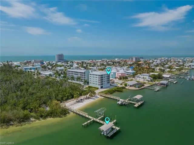Bayfront 4th floor condo with a deeded dock, lift and boat cover.