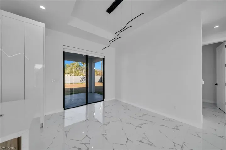 Spare room with recessed lighting and light marble finish flooring