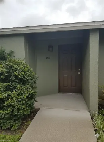 Property entrance with stucco siding