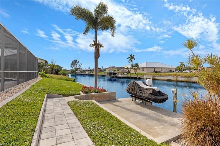 The pavers extend all the way to the concrete dock which offers a jet ski lift. This space is also great to enjoy our great climate.