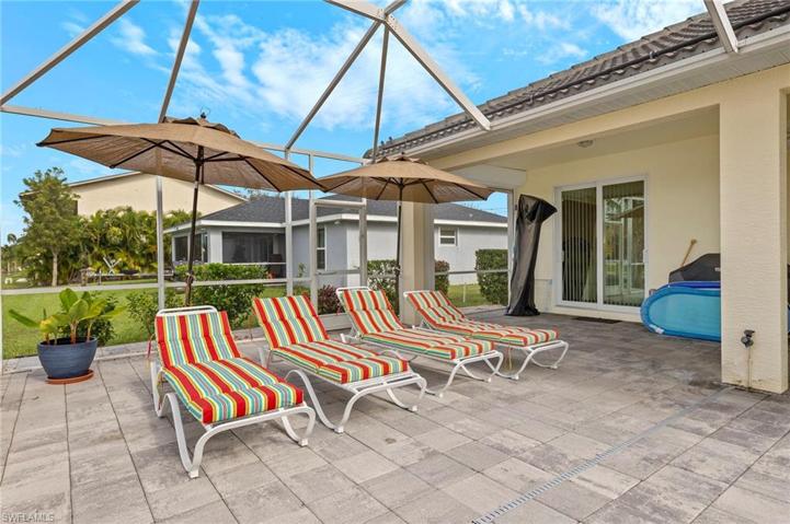 The large patio area allows sun lovers as well as those wanting shade more than enough space to find a private spot to enjoy the Florida lifestyle. Behind that slider is the back guest bedroom.