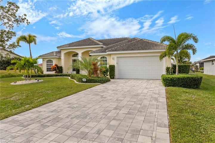 Great front elevation complete with tile roof and driveway upgraded with pavers. Lovingly maintained landscaping welcomes you and your guest.