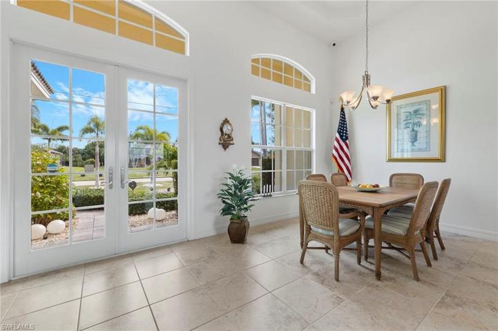 The large window and the glass double door entry will invite your guests into this bright space.