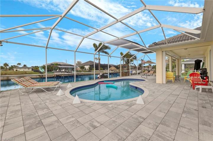 Check out all this space. The entire pool area has pavers and is screened in. Enjoy the amazing Florida sunsets from your new home.