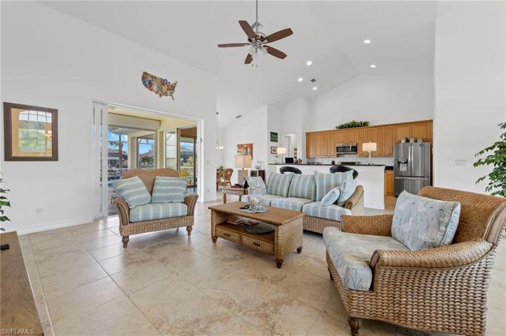 The high ceilings add an open an airy feeling to the already spacious great room. This great space also opens to a large covered pool area, perfect for enjoying the Florida lifestyle.