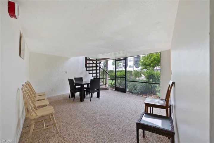 Cabana on 1st floor walkout to landscaped garden patio and pool.