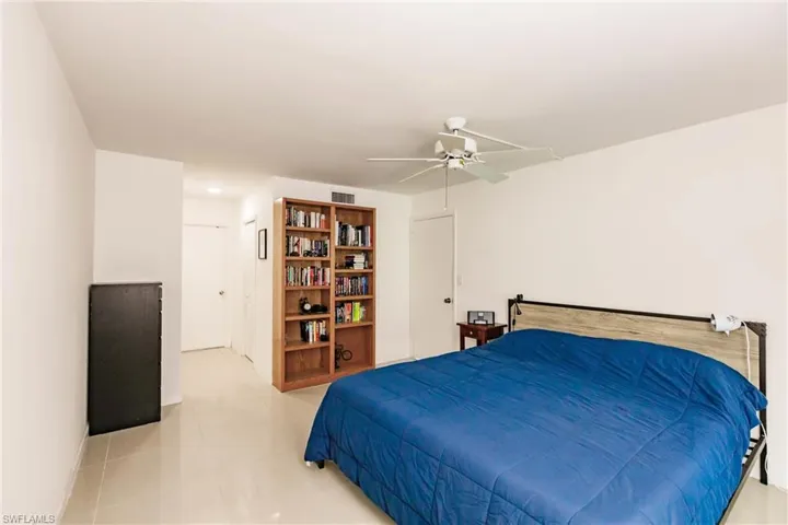 Tiled bedroom with ceiling fan