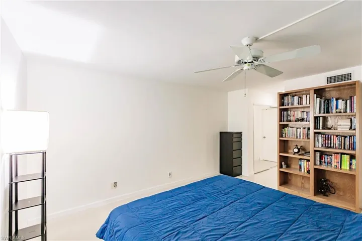 Bedroom featuring carpet and ceiling fan