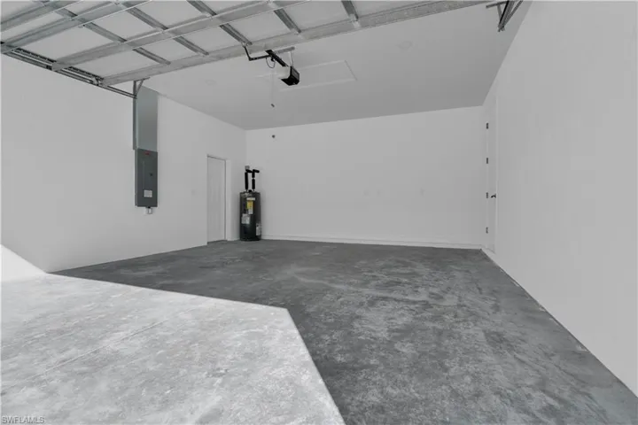 Garage with electric panel and electric water heater