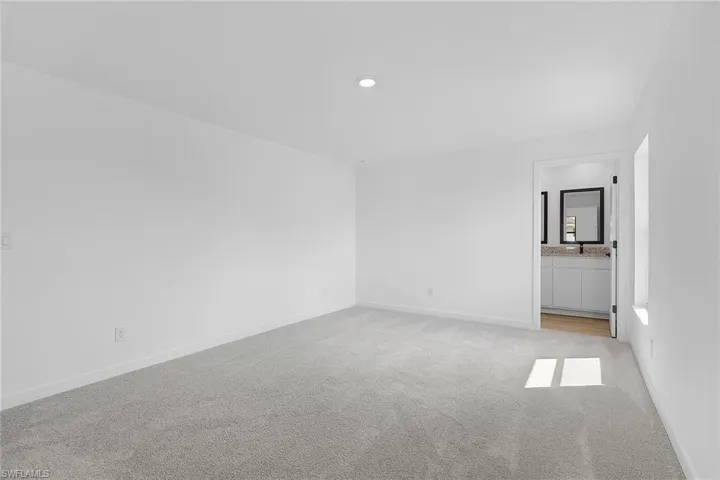 Unfurnished room featuring light colored carpet and recessed lighting