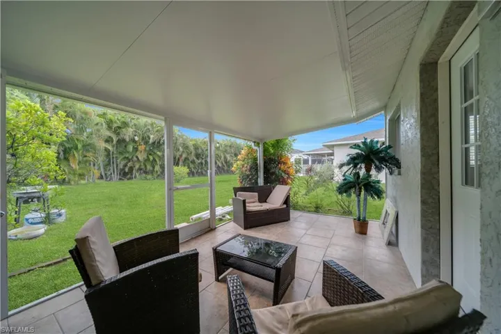 Sunroom with an outdoor lounge area and a patio