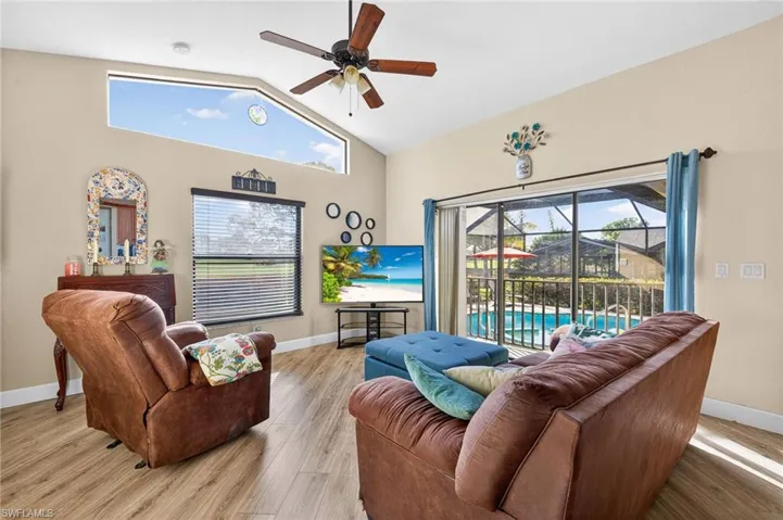 Living room featuring a ceiling fan and light wood finished floors