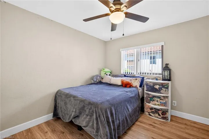 Bedroom featuring light wood-style flooring and a ceiling fan