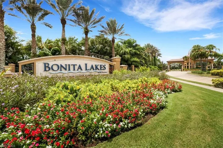 Community sign featuring a lawn