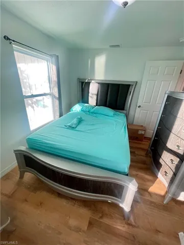 Bedroom featuring hardwood / wood-style flooring