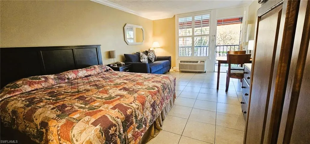 Tiled bedroom with crown molding