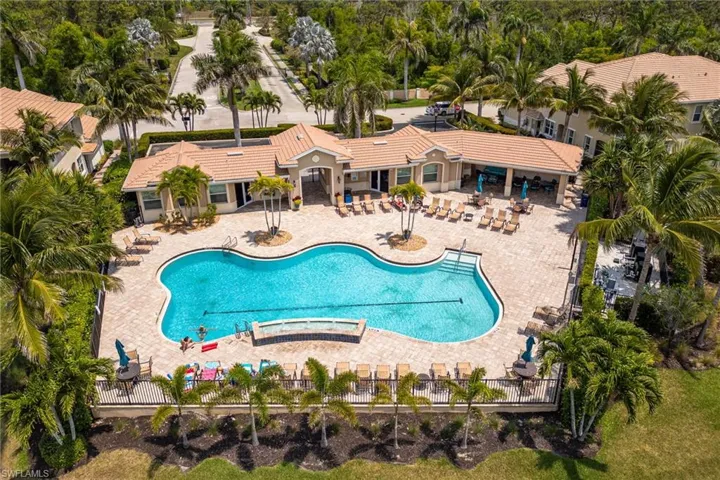 Community pool with a patio area