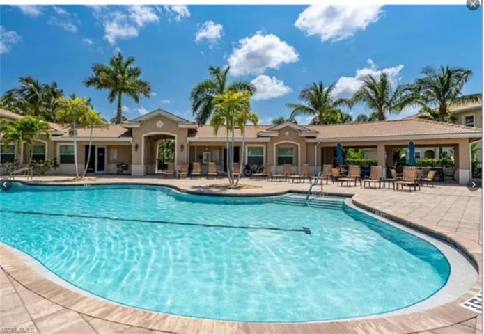 Community pool featuring a patio