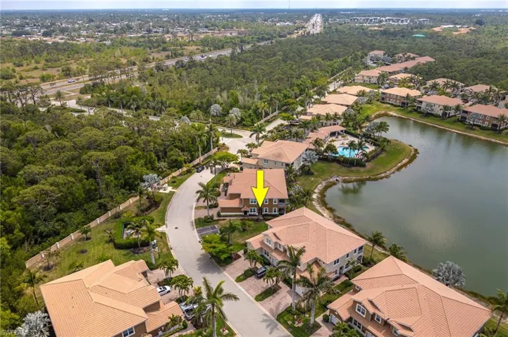 Aerial perspective of suburban area with a nearby body of water
