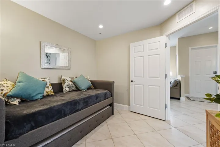 Den/Bedroom featuring light tile patterned floors and recessed lighting