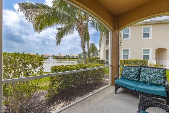 Sunroom with a water view