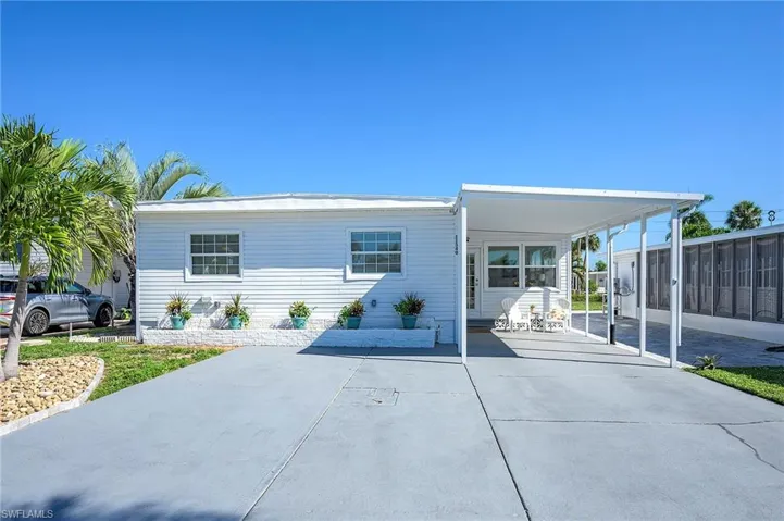 View of front of house with a carport