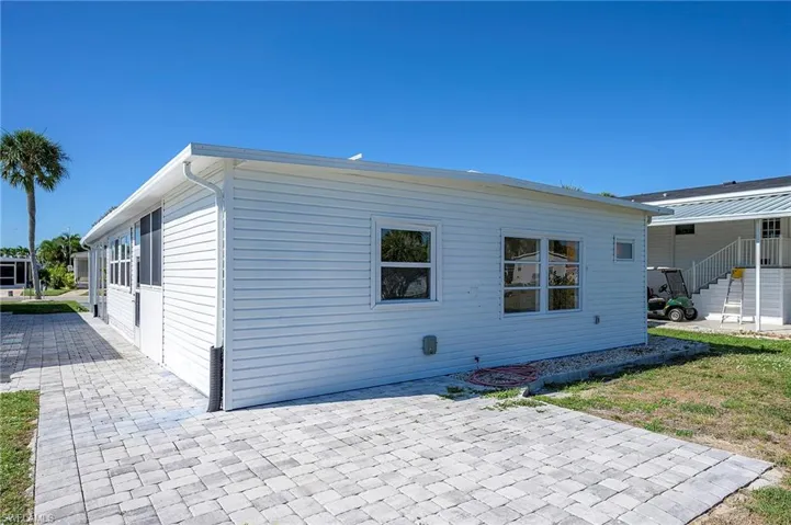 View of side of property with a patio area