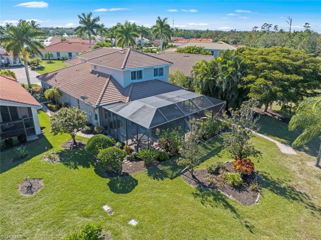Rear of home has plenty of mature landscaping