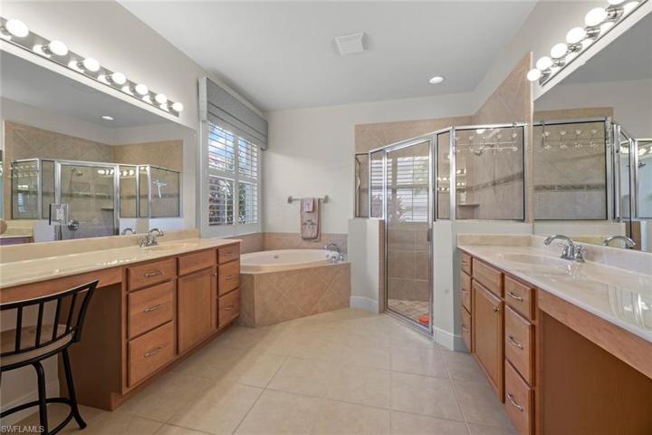Master bath w/dual vanities, large walk-i shower, Jacuzzi tub
