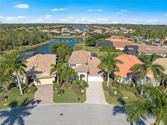 Aerial view of front of home w/lake behind