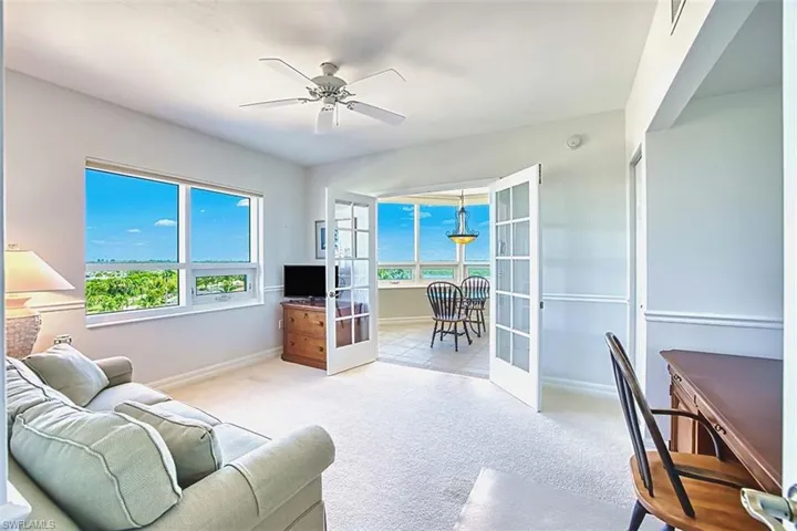 Light filled_Den_with french_doors looking toward Breakfast Nook