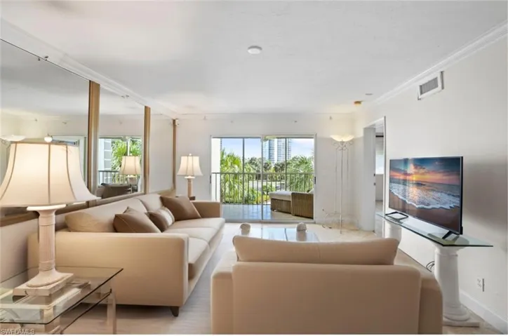 Living room-partial staged-featuring crown molding and baseboards