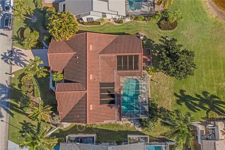 Aerial view of property and surrounding area with a pool area