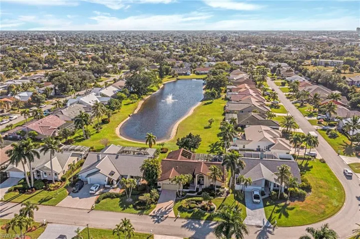 Aerial view of residential area featuring a large body of water