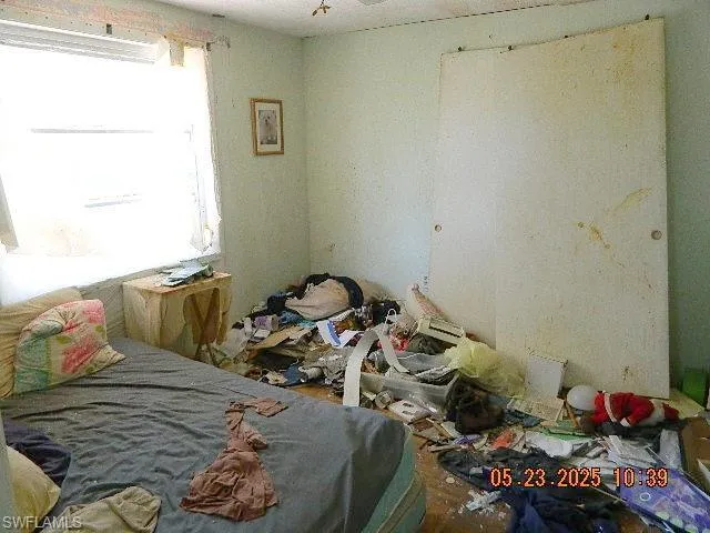 Bedroom featuring an AC wall unit